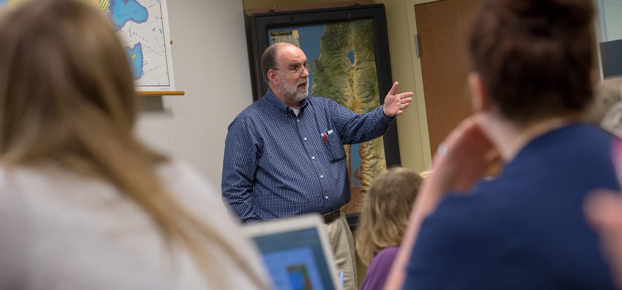 Dr. Carrell, a college of Christian studies professor teaches a class in the Meyer Christian Studies Building.
