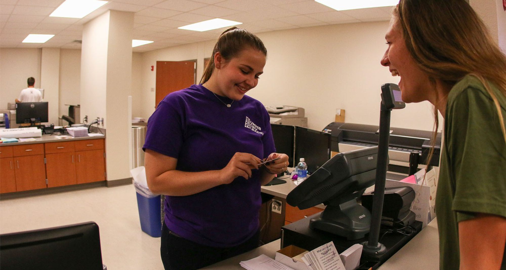 Student being helped at the CruCard and Copy Center