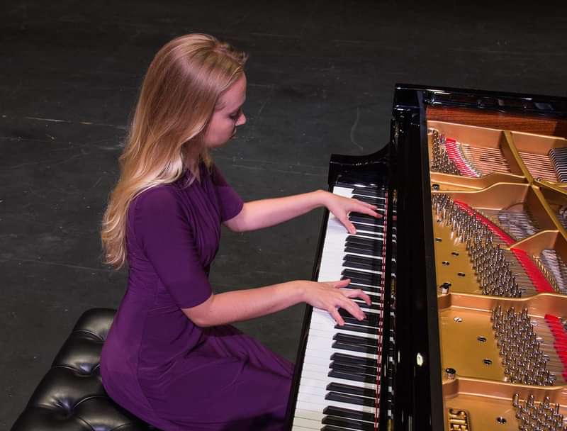 Zaida Louther plays the piano in Baugh Performance Hall.