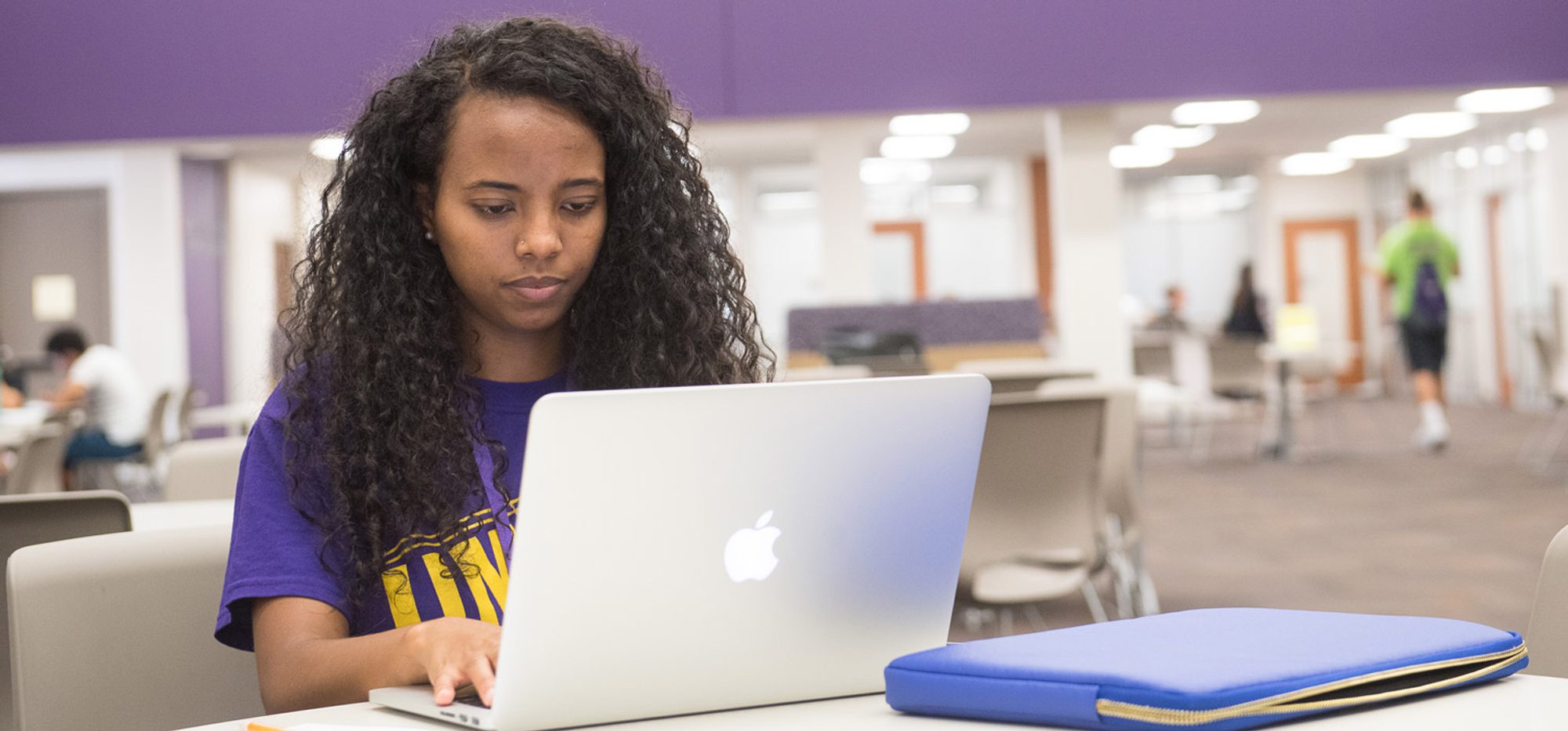 Student working on laptop in Mabee Student Success Center. Student working on laptop in Mabee Student Success Center.