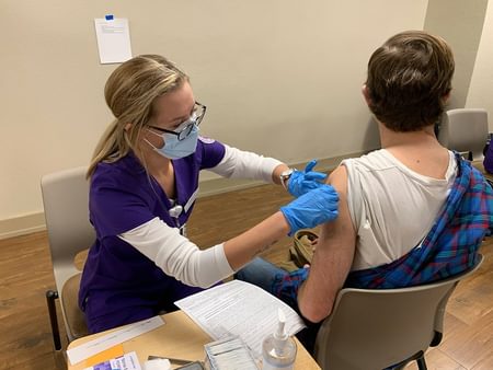 Image for Nursing students help with COVID-19 vaccinations