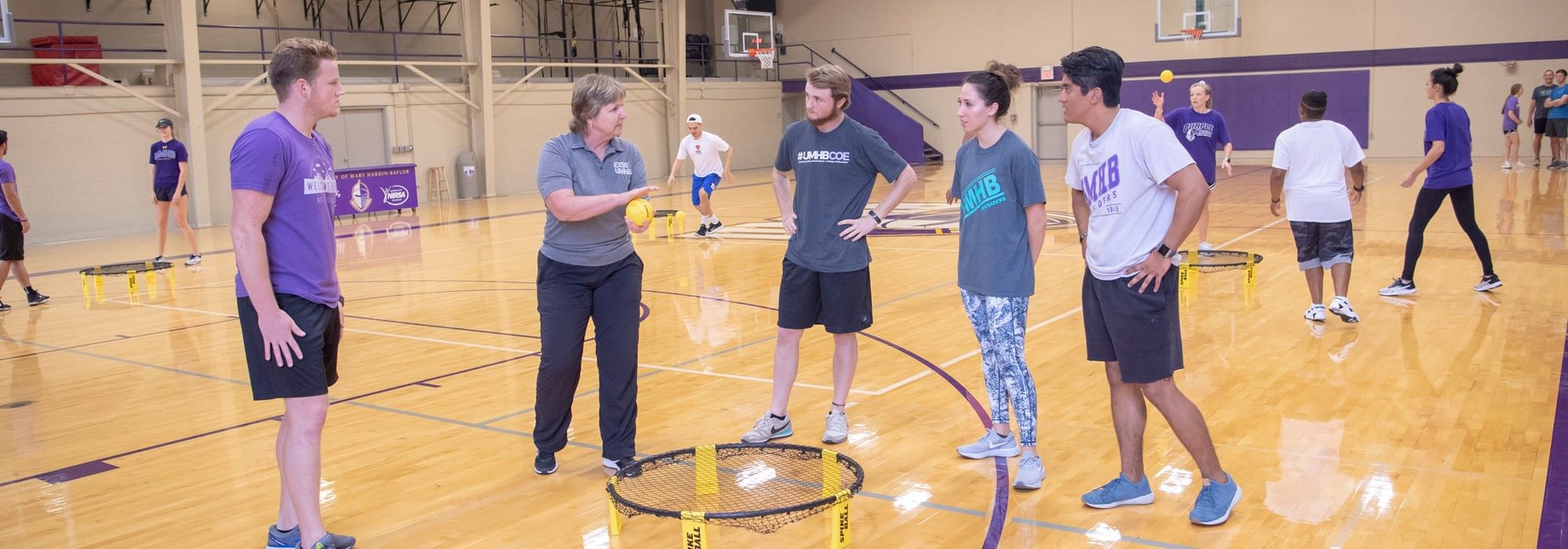 Degree in physical education students learning the art of coaching from pe teacher program professor at UMHB.