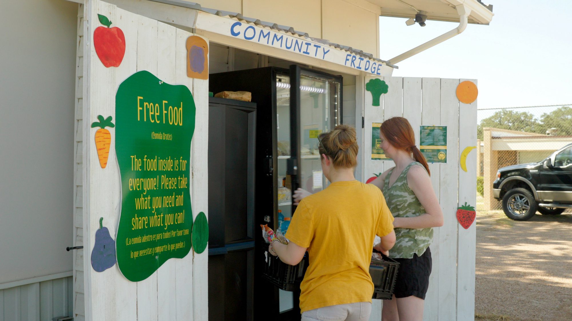 women working at community center promoting community adovacy.