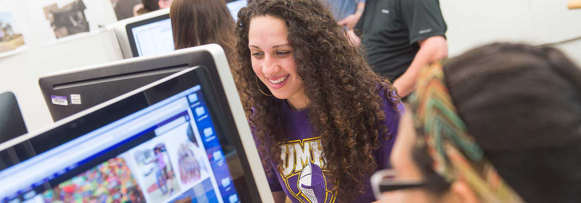 Graphic design degree students working on designs during graphic designing course at UMHB.