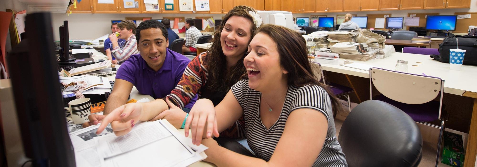 Public relations degree students working on a communications project for pr class at UMHB.