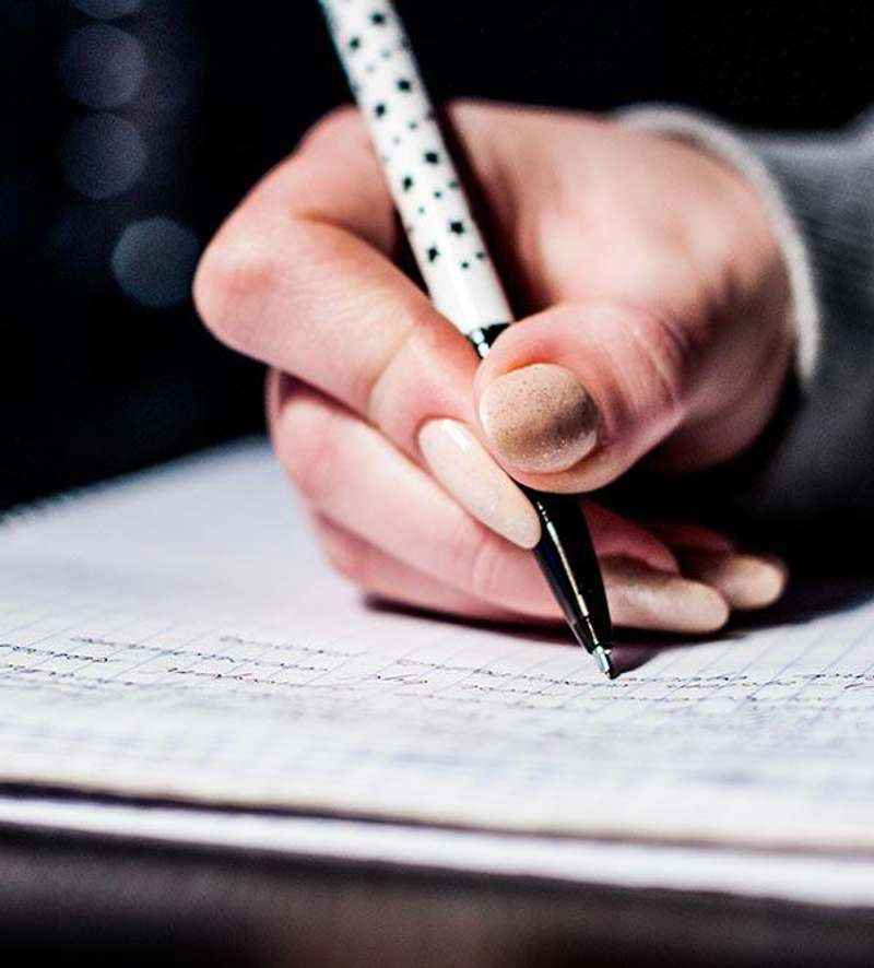 Photo of person taking an exam Photo of person taking an exam
