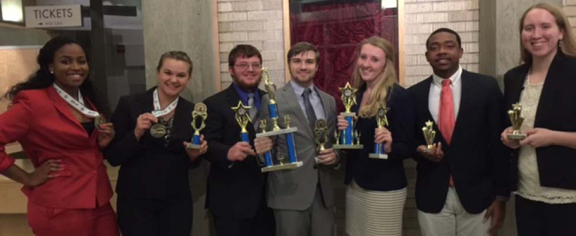 Speech Cru after winning awards at an event. Speech Cru after winning awards at an event.