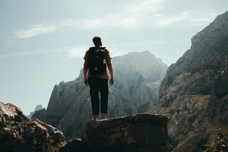 Discover your purpose man climbing a mountain Discover your purpose man climbing a mountain