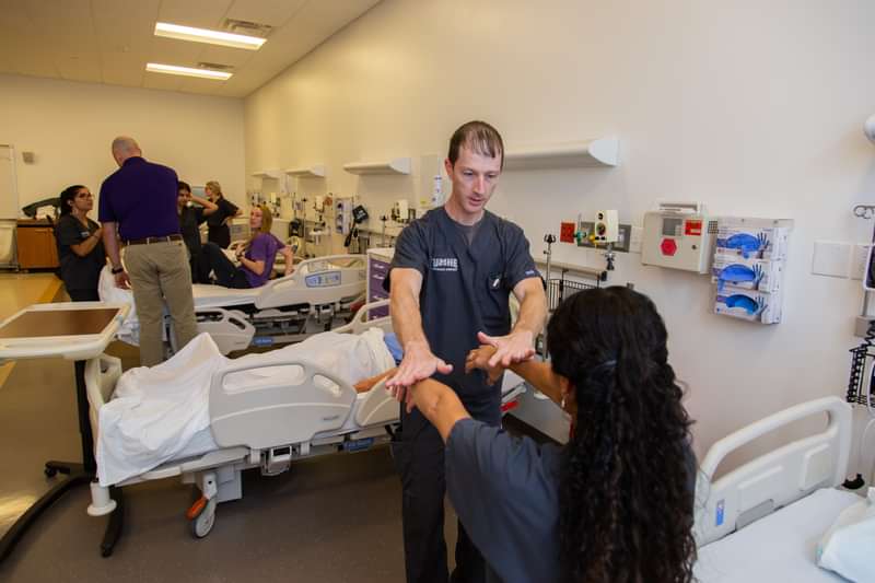 Physician assistant student Christopher Mann trains to diagnose rotator cuff problems.